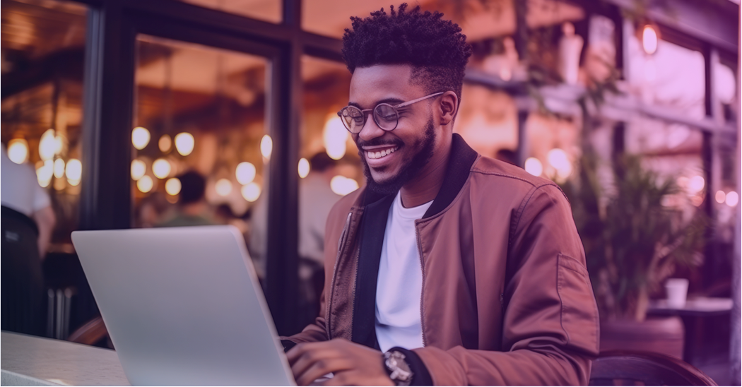 Smiling professional on laptop