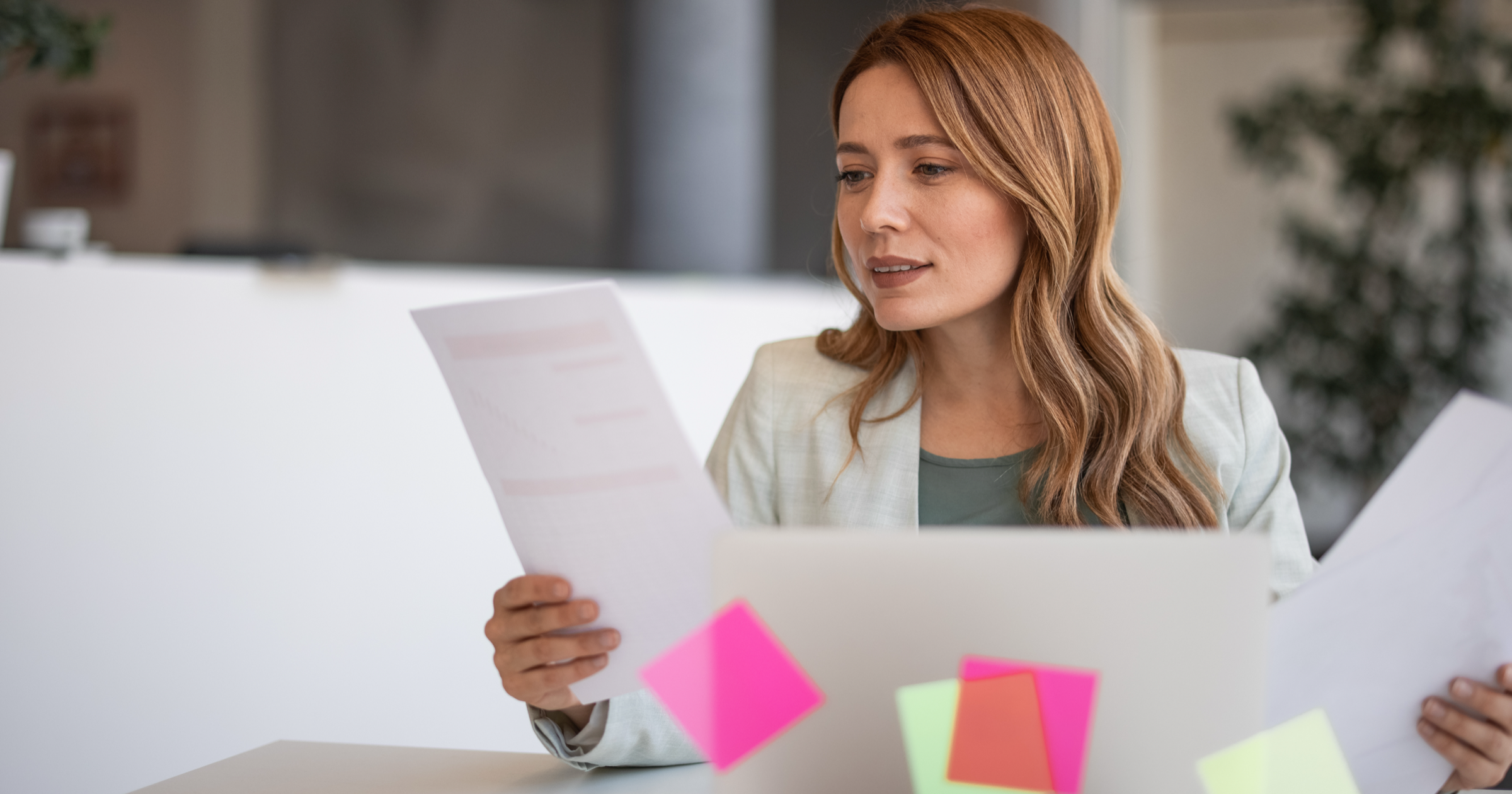 Young professional woman looking at documents.